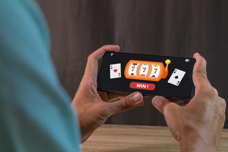 মোবাইলে six6bet অ্যাপে ফুটবল বেটিং উপভোগ করছেন একজন প্রাপ্তবয়স্ক ব্যবহারকারী